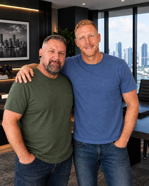EvenPath’s two founders standing side by side in an office, one with an arm around the other’s shoulder
